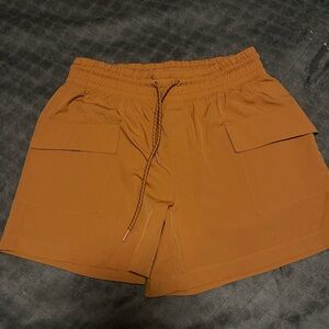 Never not Hustlibg Women's Athletic Shorts in Tan